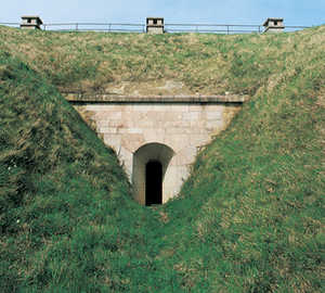 159. Gun emplacement of the casemated battery of St. Mark's Fort, from outside. The upper and front blindages of the casemate are covered in grass. One of the ventilation shafts of the casemate can be seen over the gun emplacement.© Gorka Agirre